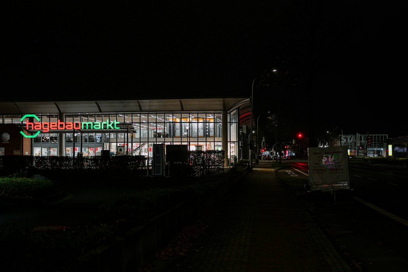 Illuminated retail storefront signage at night